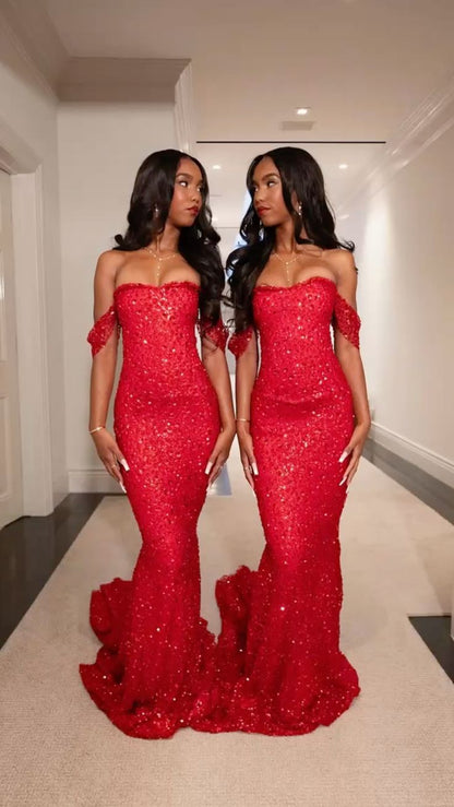 Robe de soirée longue rouge à paillettes, épaules dénudées, style sirène, ornée de sequins, idéale pour les bals de fin d'année et les dîners chics. Modèle AB2086.