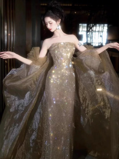Elegantes Meerjungfrauen-Trägerlos-Champagner-Pailletten-Ballkleid mit Cape für Partys N2031