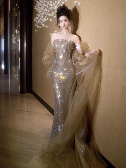 Elegantes Meerjungfrauen-Trägerlos-Champagner-Pailletten-Ballkleid mit Cape für Partys N2031